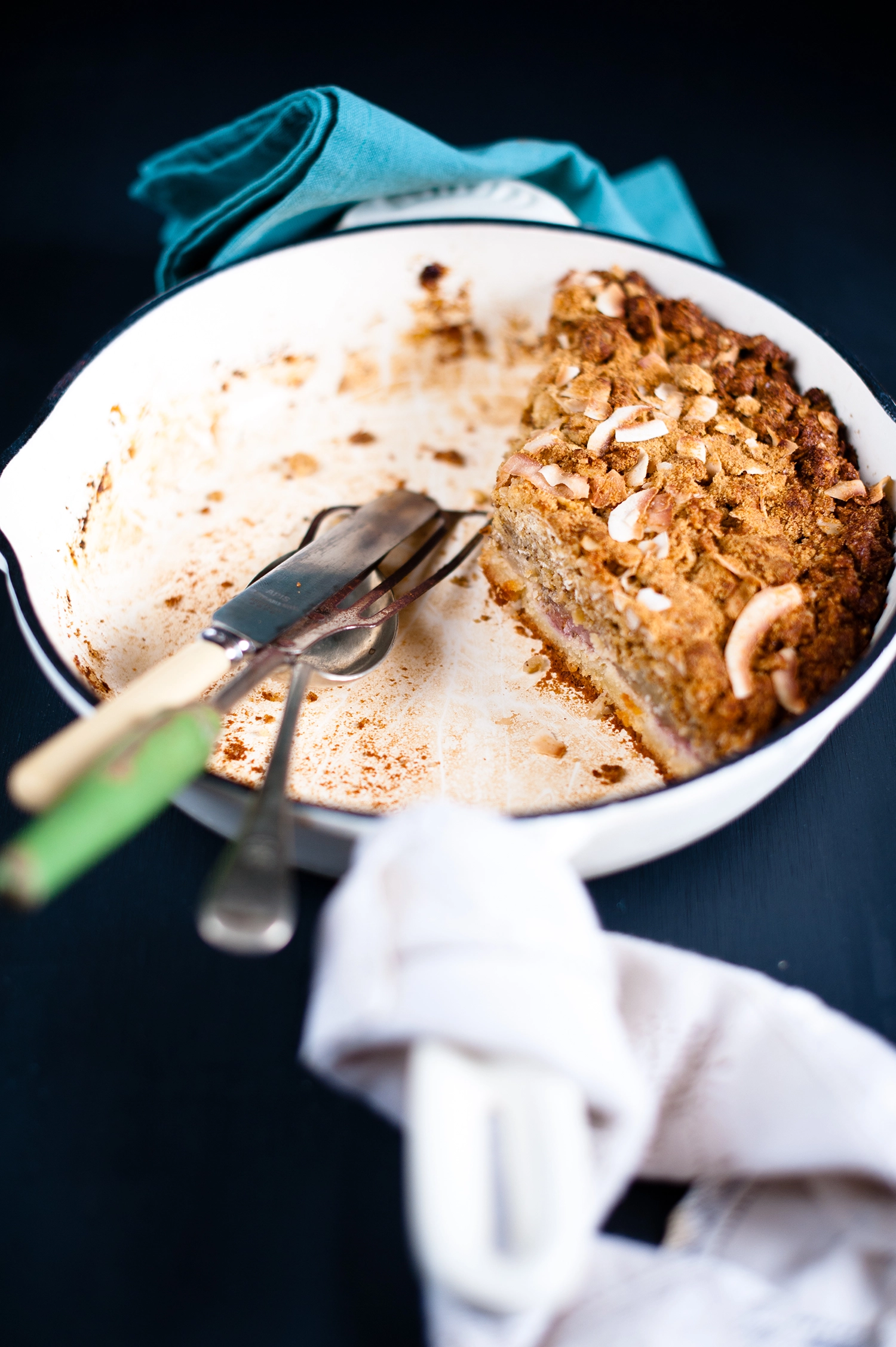 A rustic gluten free raspberry frangipane cake topped with soft apple compote and a golden ANZAC crumble made from oats, coconut and almonds; a rich, fruity almond cake with crisp, buttery edges.