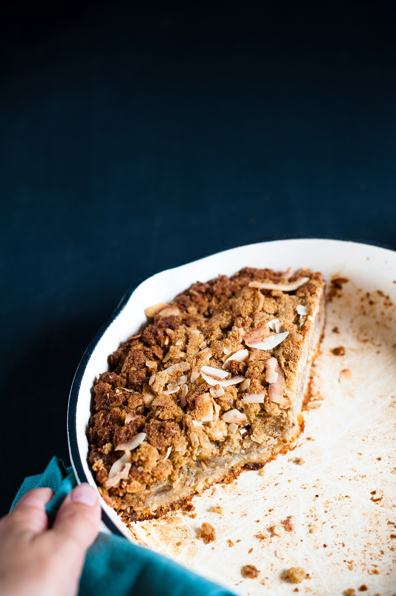 A rustic gluten free raspberry frangipane cake topped with soft apple compote and a golden ANZAC crumble made from oats, coconut and almonds; a rich, fruity almond cake with crisp, buttery edges.