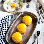 Small gluten free passionfruit cakes topped with smooth lime curd icing, showing a light, fluffy crumb and fresh passionfruit seeds; a bright and zesty mini cake dessert.