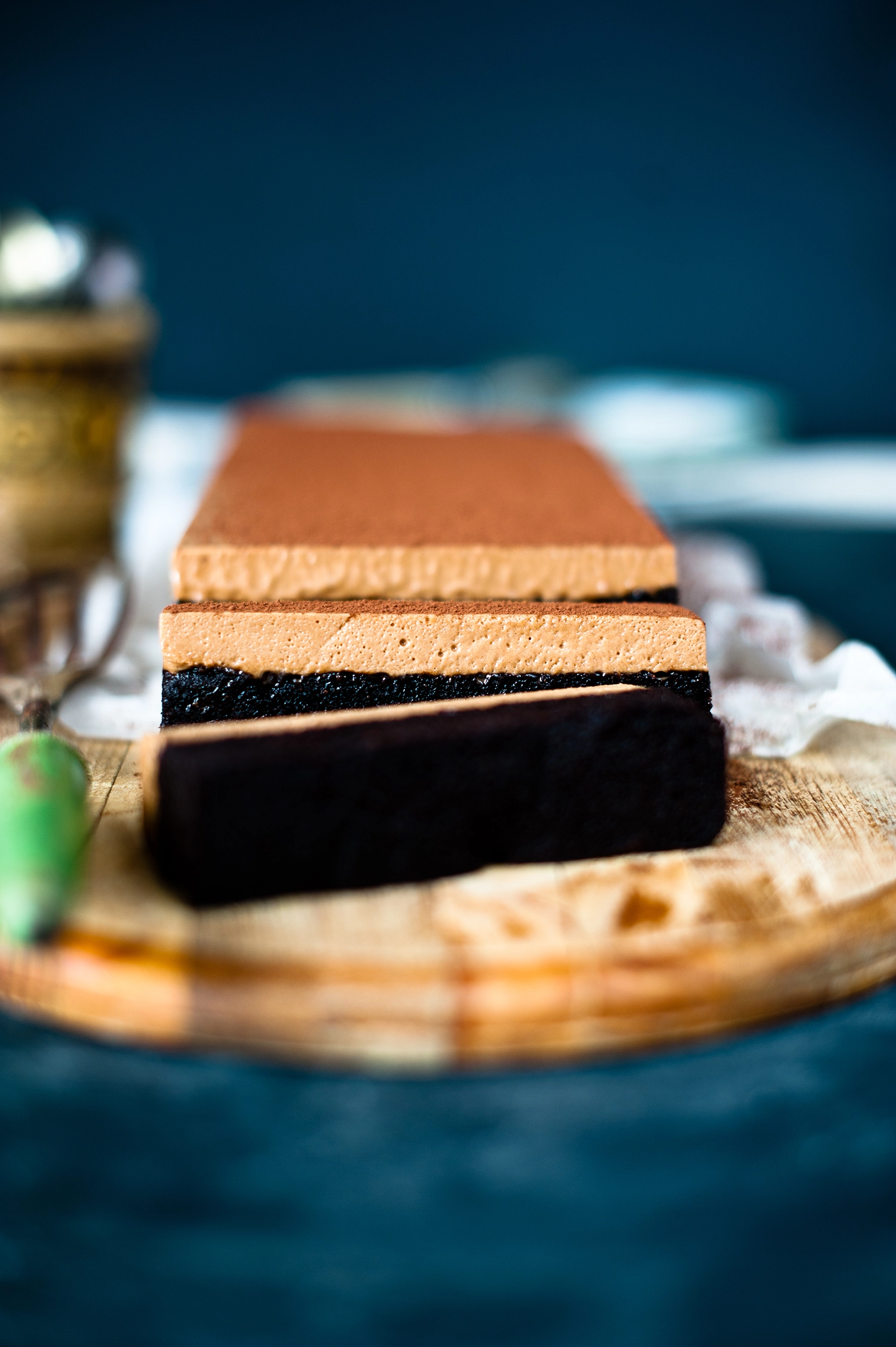 A rich gluten free chocolate brownie cake layered with smooth chocolate mousse and dusted with cocoa powder; a decadent gluten free dessert perfect for celebrations.