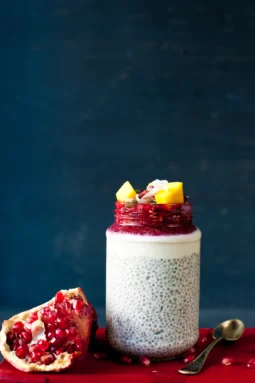 Creamy vanilla cinnamon chia pudding layered with coconut cashew cream, roasted plums, mango and pomegranate. A healthy gluten-free, dairy-free vegan breakfast perfect for meal prep.