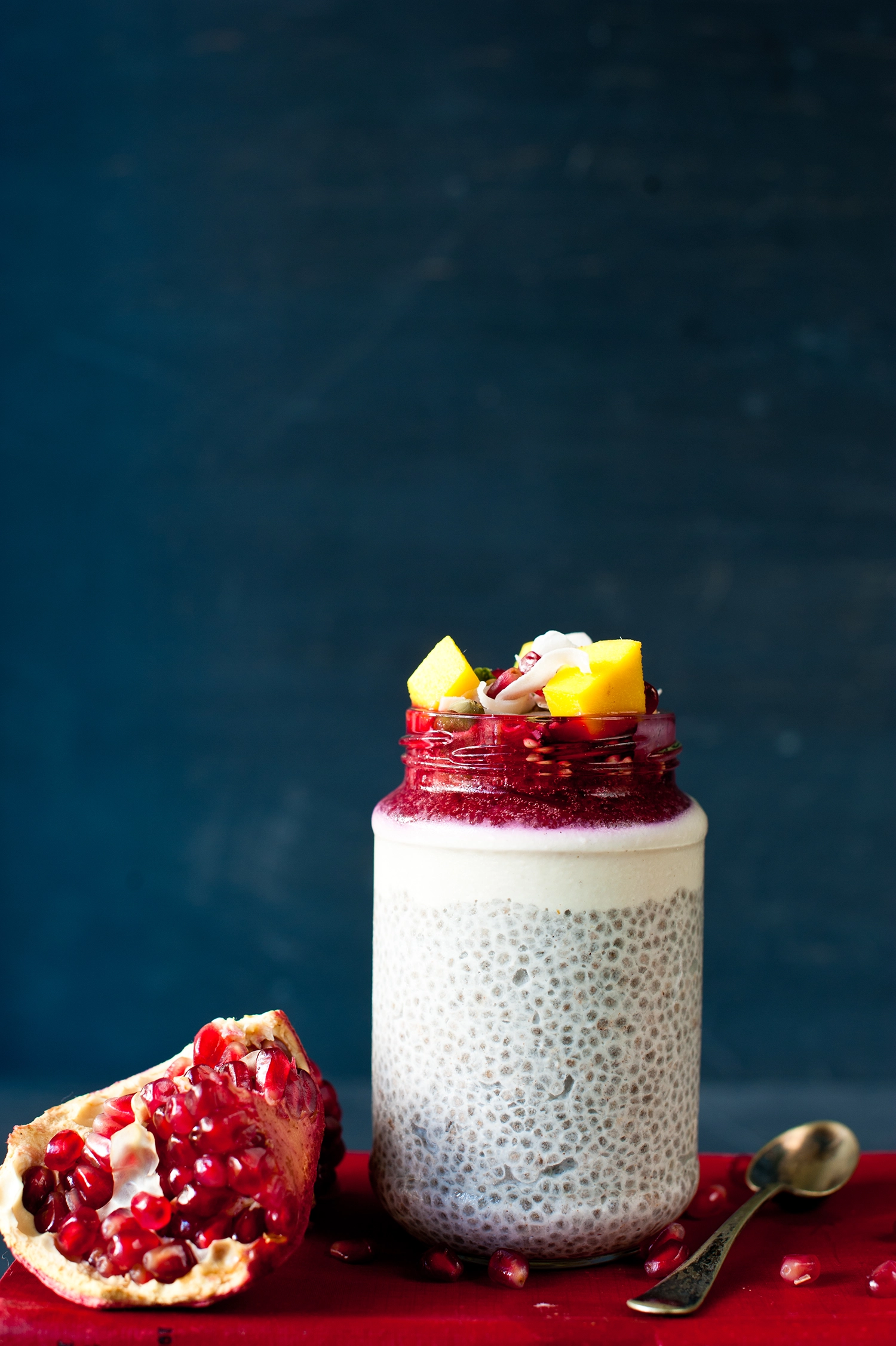 Creamy vanilla cinnamon chia pudding layered with coconut cashew cream, roasted plums, mango and pomegranate. A healthy gluten-free, dairy-free vegan breakfast perfect for meal prep.