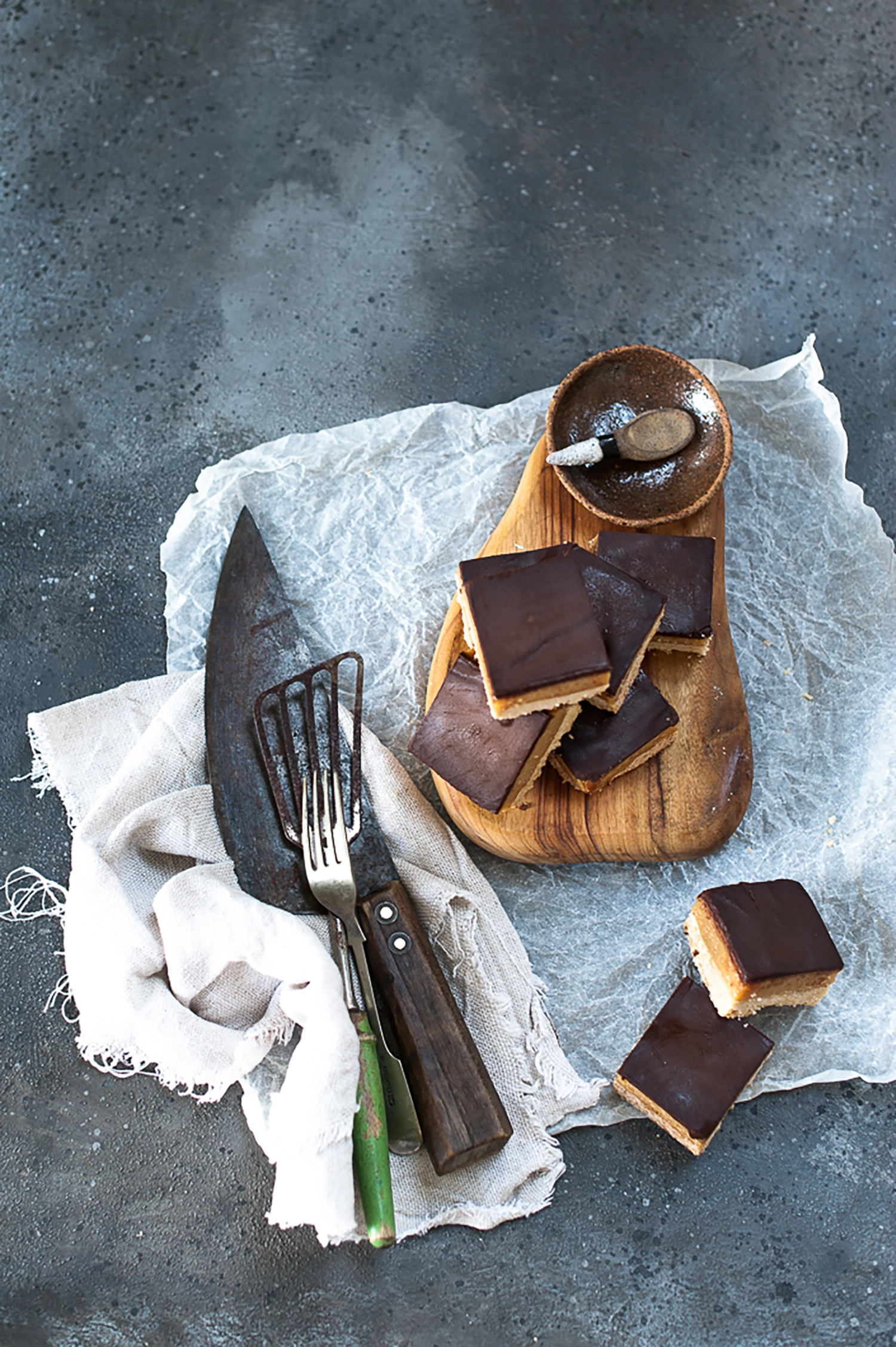 Gluten free salted caramel slice with buttery coconut base, thick caramel filling and smooth dark chocolate topping. The perfect sweet and salty treat for afternoon tea.