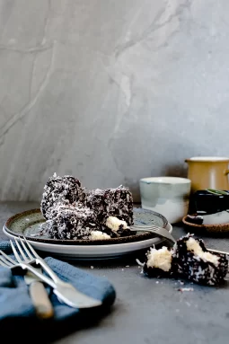 Classic chocolate lamingtons made gluten free and dairy free. Light genoise sponge dipped in rich chocolate glaze and coated in coconut — perfect for Australia Day or afternoon tea.