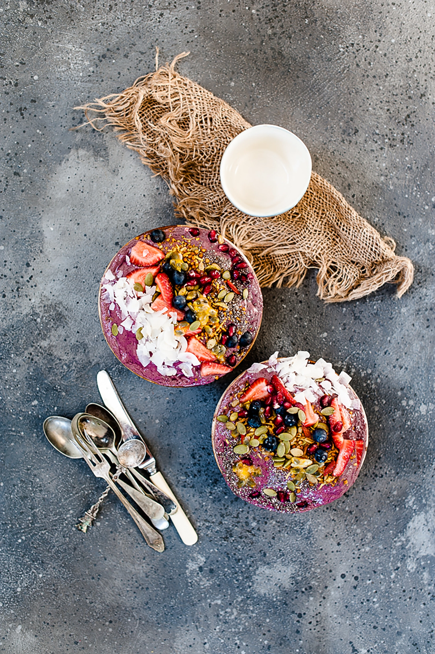 A creamy, breakfast smoothie bowl packed with protein, cinnamon and avocado. Low in sugar, high in nourishment — the perfect healthy summer breakfast.