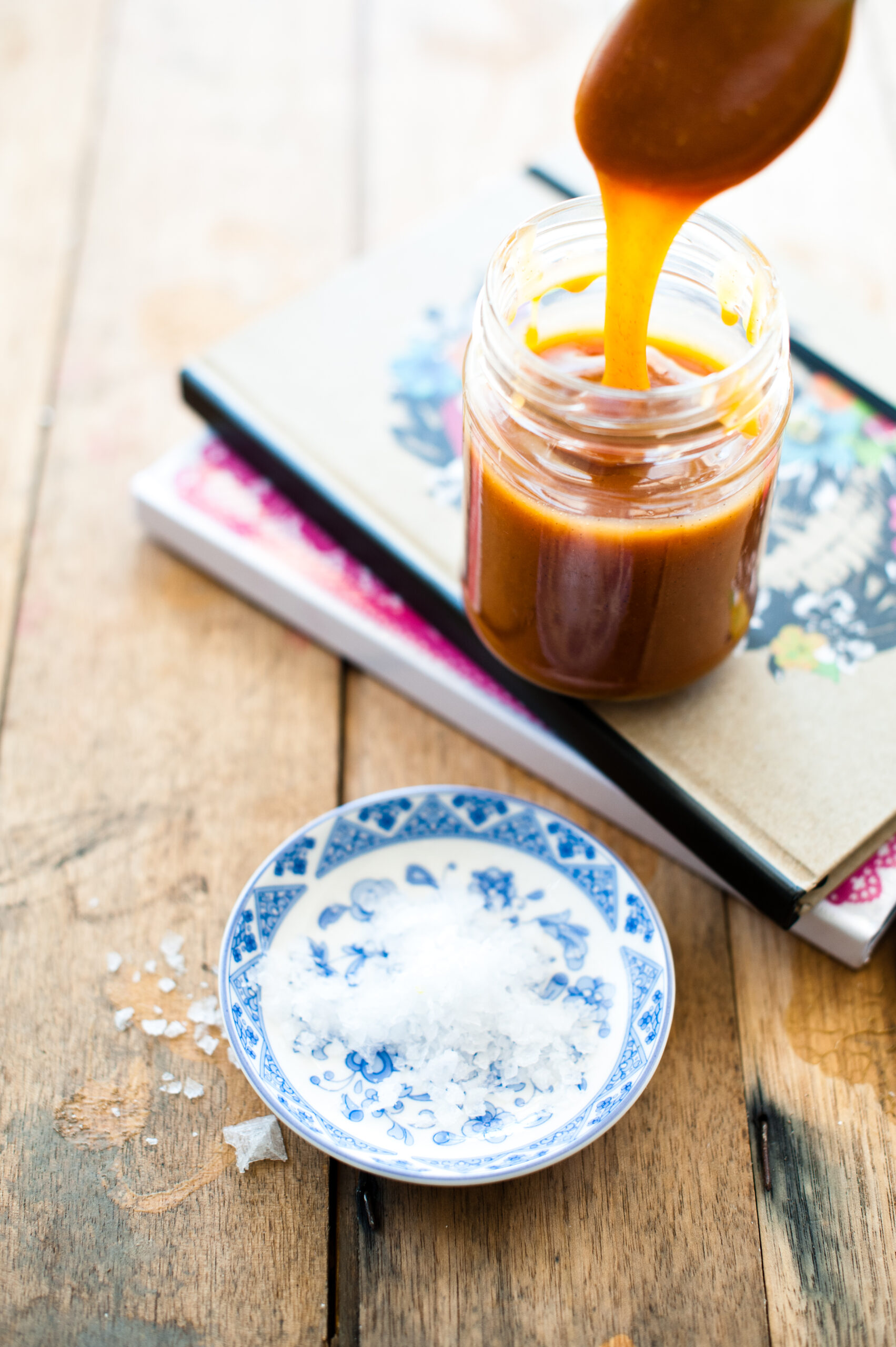 salted caramel being spooned out of jar