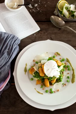 Easy gluten-free sweet potato gnocchi with veggies, pine nuts, and poached egg