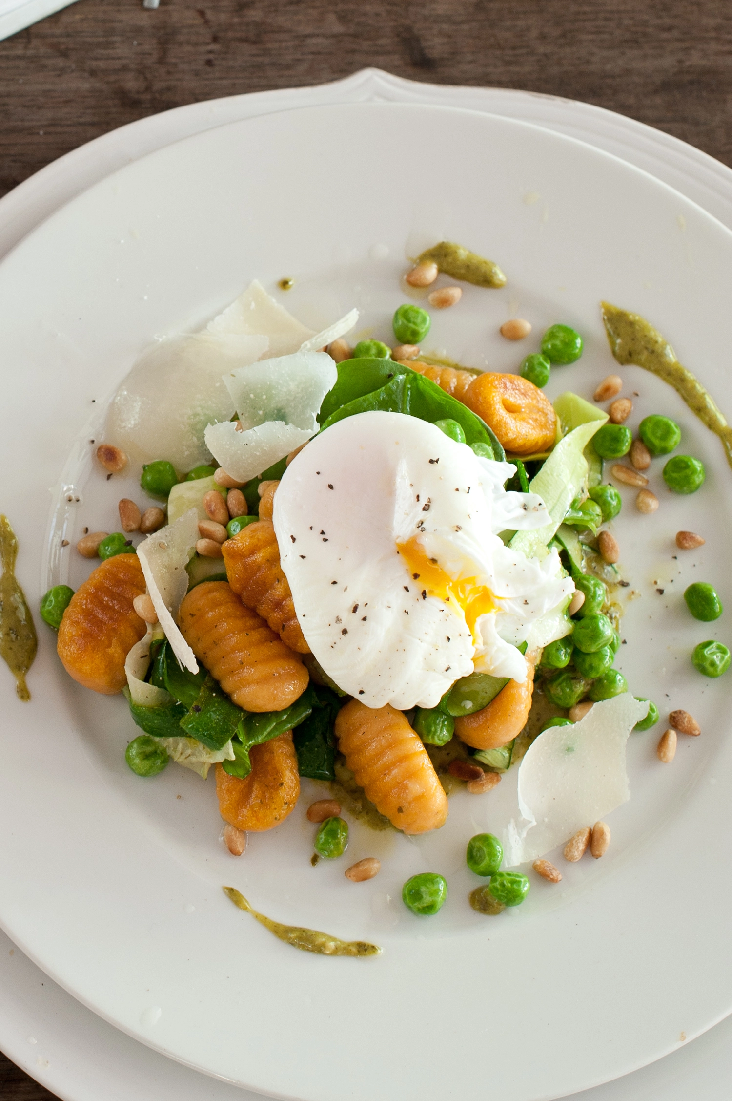 Easy gluten-free sweet potato gnocchi with veggies, pine nuts, and poached egg